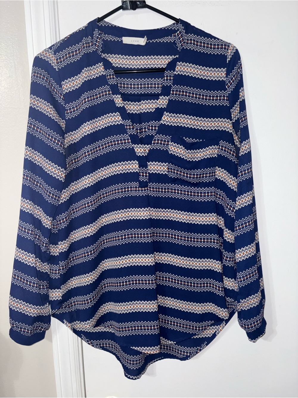 Lush blue and white geometric striped blouse small